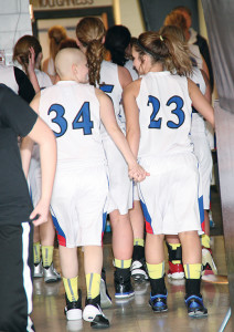 “BENCH BUDDIES” as senior Kelbi Dean dubbed them, she and Tanna Kingsbury walk into the locker room hand-in-hand after they both got to debut on the big stage of the state tourney Thursday night. Kingsbury has spent a year battling a rare and aggressive form of cancer, while Dean has been plagued with severe concussions. Both have continued to be great sources of support for their team from the sidelines. Dean even gave the halftime pep talk to her team during the championship game.