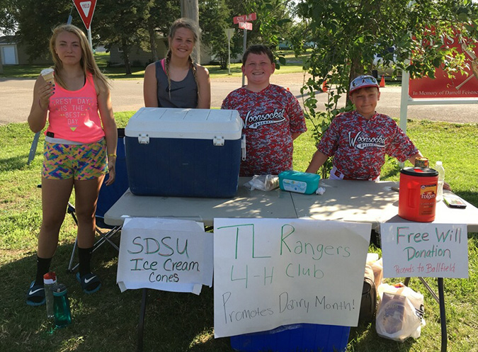 Pictured above are four of the TL Rangers 4-H Club members working at the ice cream stand. From the left:  Taylor Lindsey, Taryn Ziebart, Blake Howard and Carver Lindsey.
