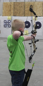 Rylan Grassel shoots in the compound archery discipline at the State 4-H Shoot this past year.