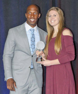 MYAH SELLAND, the South Dakota girls basketball Player of the Year, was presented her award by former Detroit Piston Chauncey Billups.