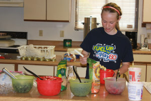 Fuel Up to Play 60 SD Ambassador Bailey Feistner teaches club members how to make an easy healthy snack.
