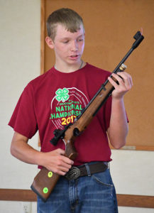 Nathan Linke explains to the audience the different parts of his gun in his illustrated talk called “Commence Fire!”